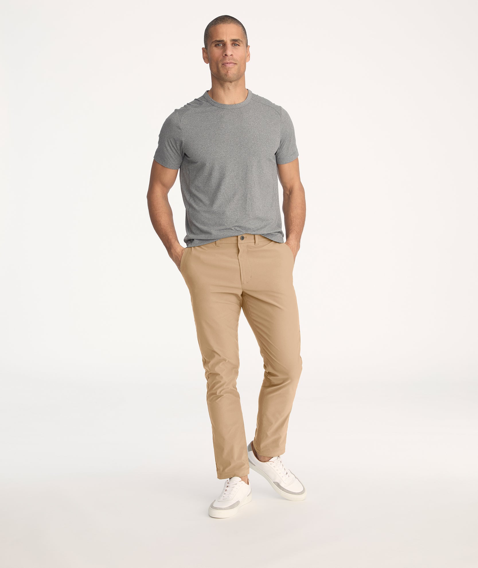 Model wearing Traveler Pant in tan - full body