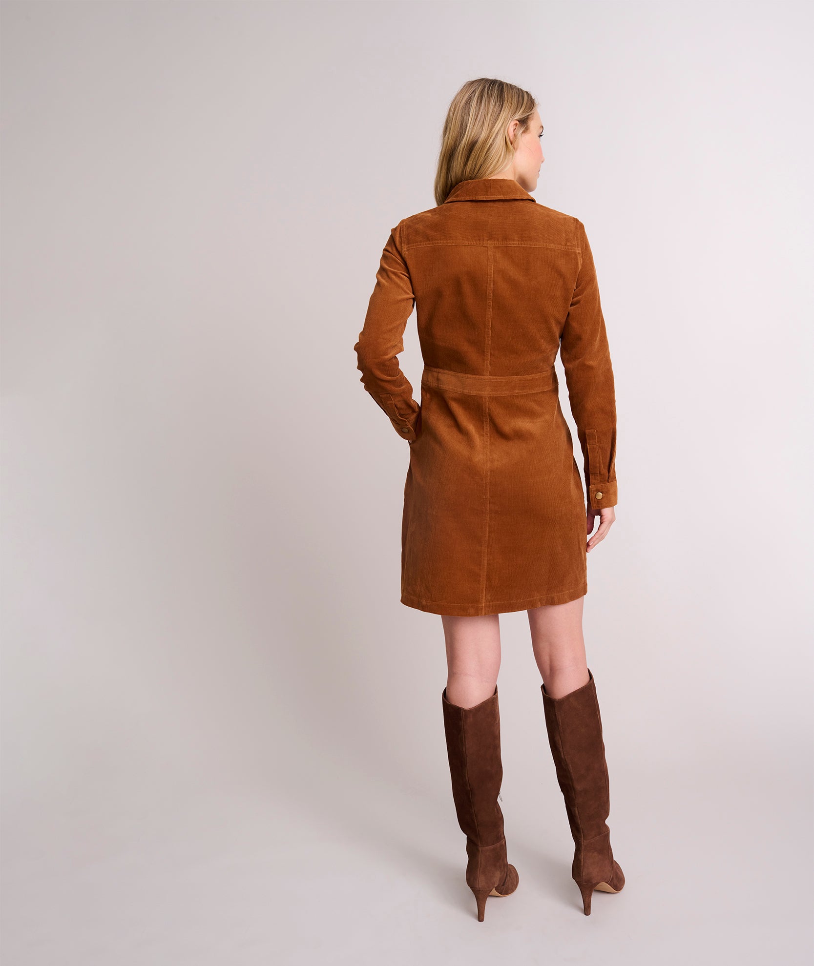 Model is wearing UNTUCKit Cord Solid Cora Shirtdress in Chestnut Brown Solid. 