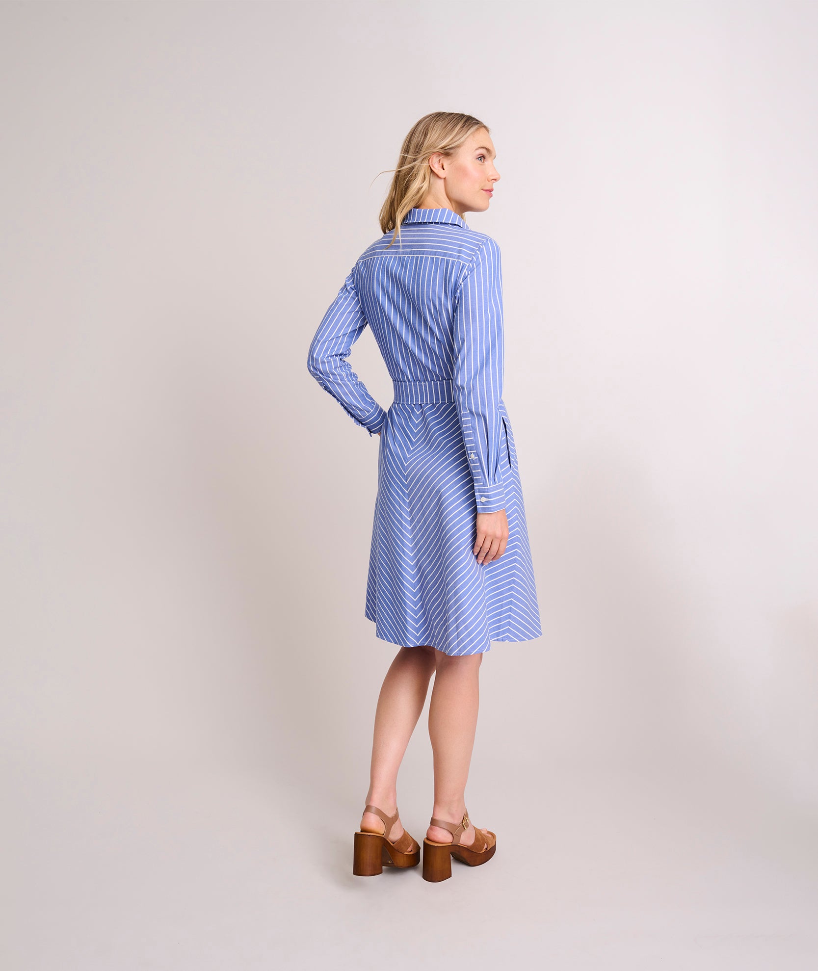 Model is wearing UNTUCKit Cotton Stretch Stripe Nadia Shirtdress. 