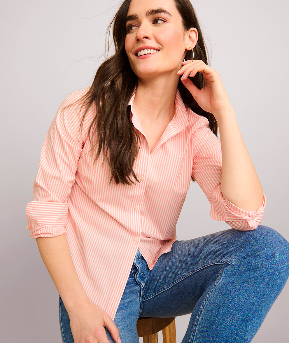 Model is wearing UNTUCKit Bella pink stripe shirt.