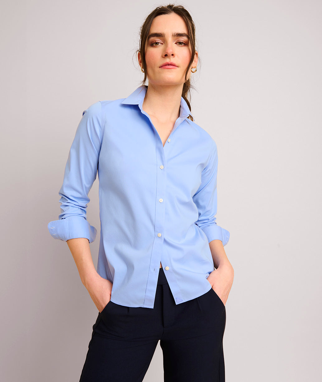 Model is wearing UNTUCKit Bella shirt in blue.