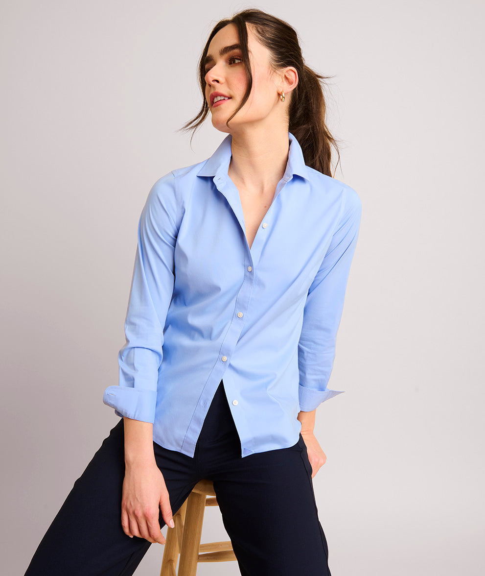 Model is wearing UNTUCKit Bella shirt in blue.