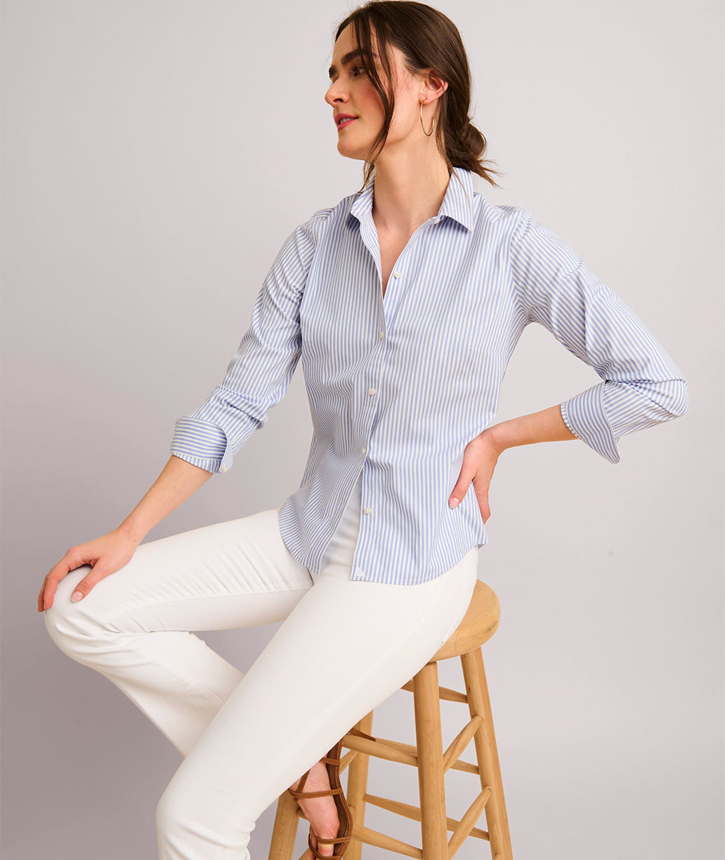 Model is wearing UNTUCKit Bella shirt in blue.