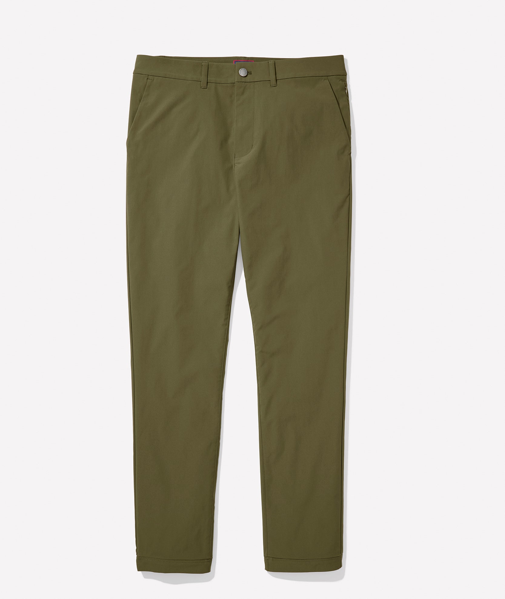 Model is wearing UNTUCKit Treveler Tech Pants in Ivy Green.