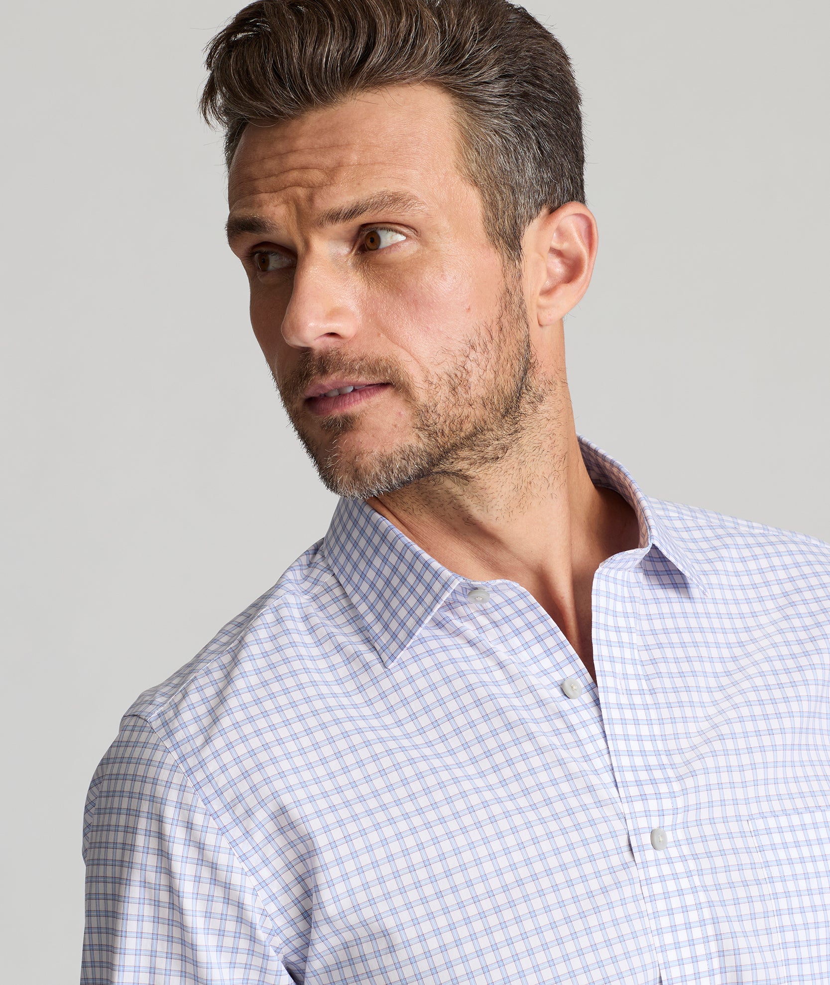 Model is wearing UNTUCKit Cunningham wrinkle-free shirt. 