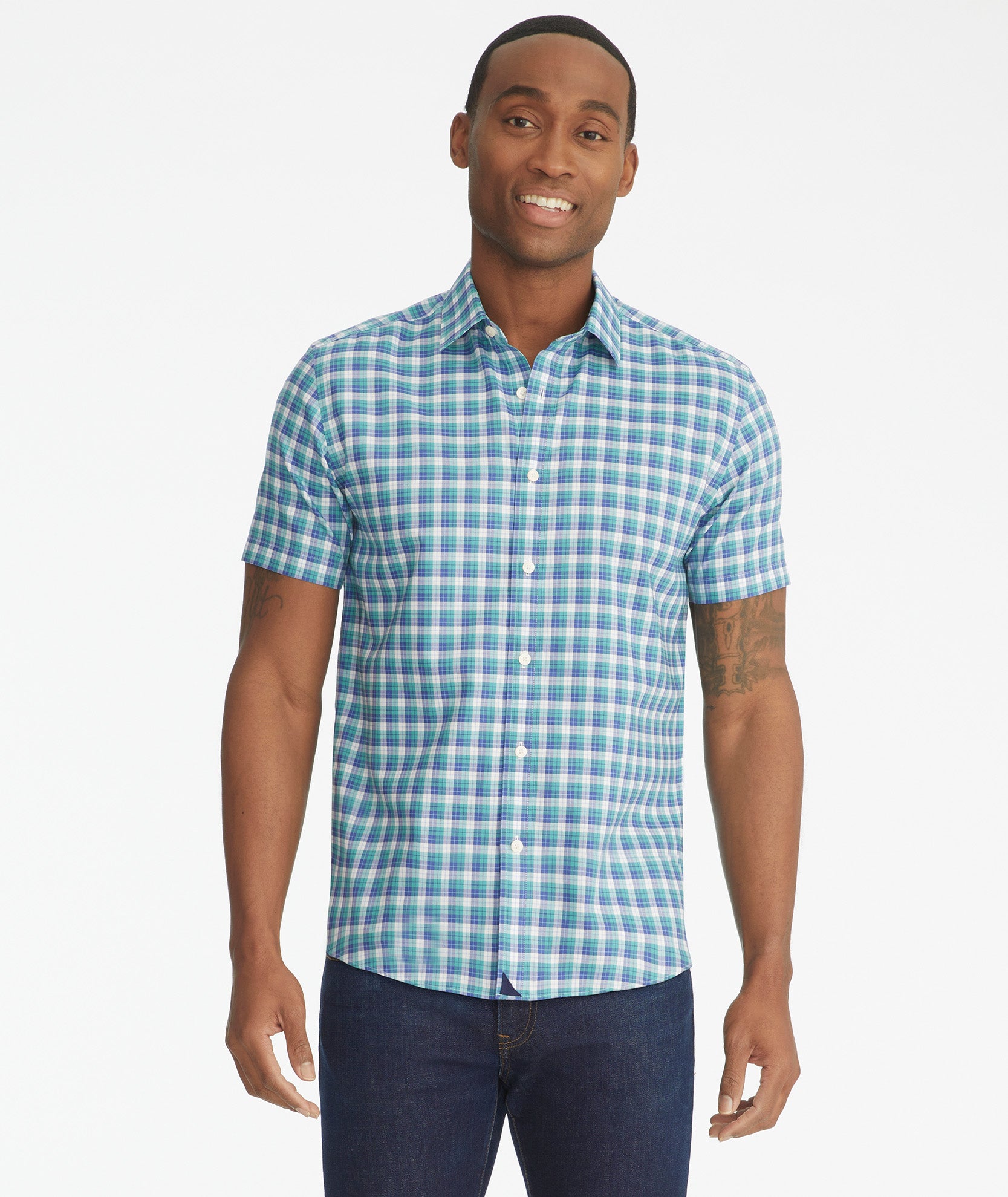 Model is wearing UNTUCKit Dameron short-sleeve button down.