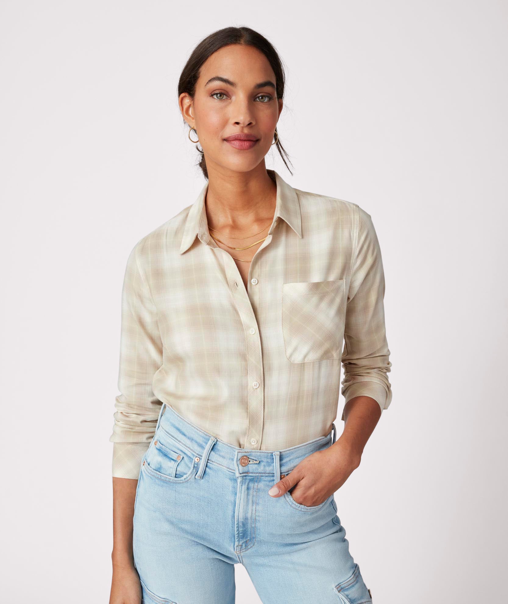 Model is wearing UNTUCKit Layla shirt in tan.