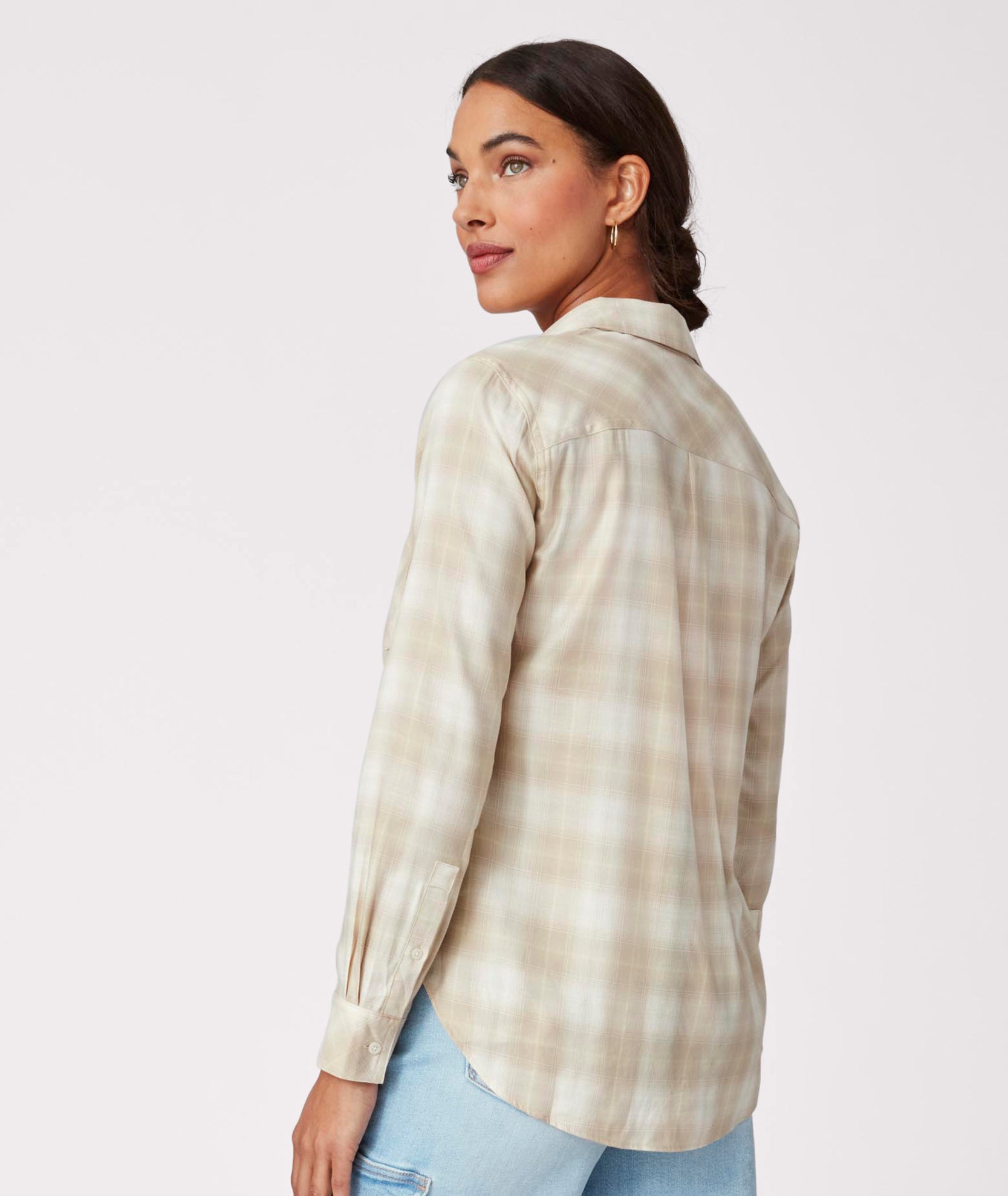 Model is wearing UNTUCKit Layla shirt in tan.