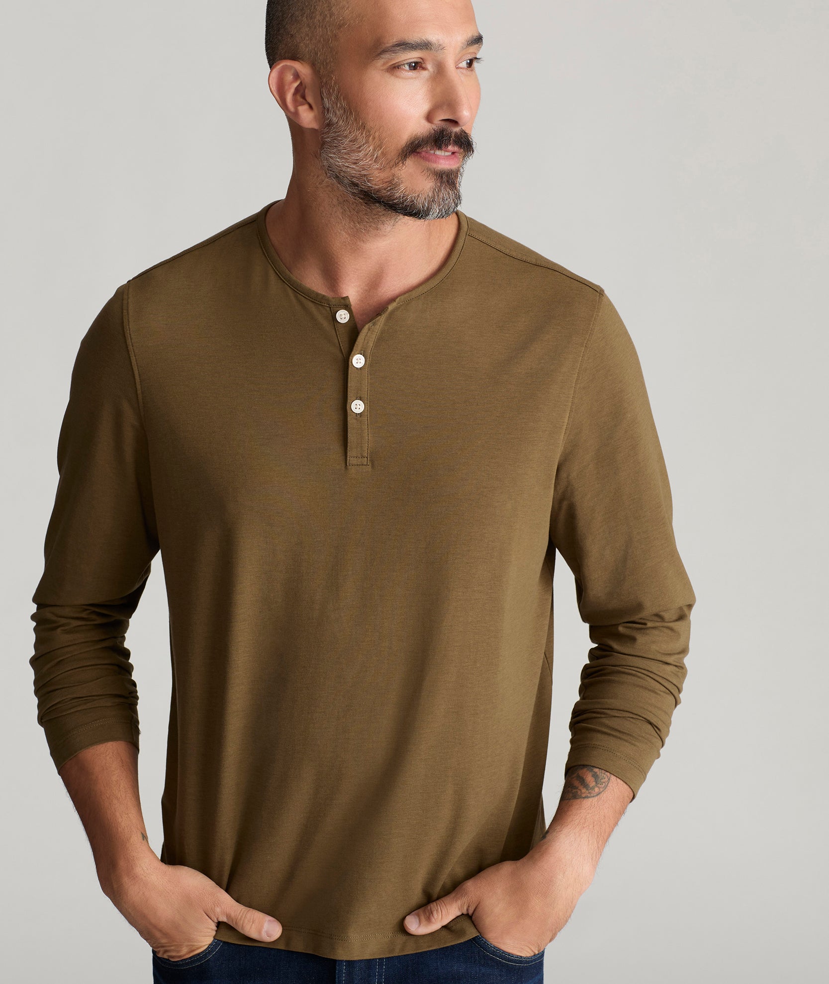 Model is wearing UNTUCKit Marastina henley in beech.