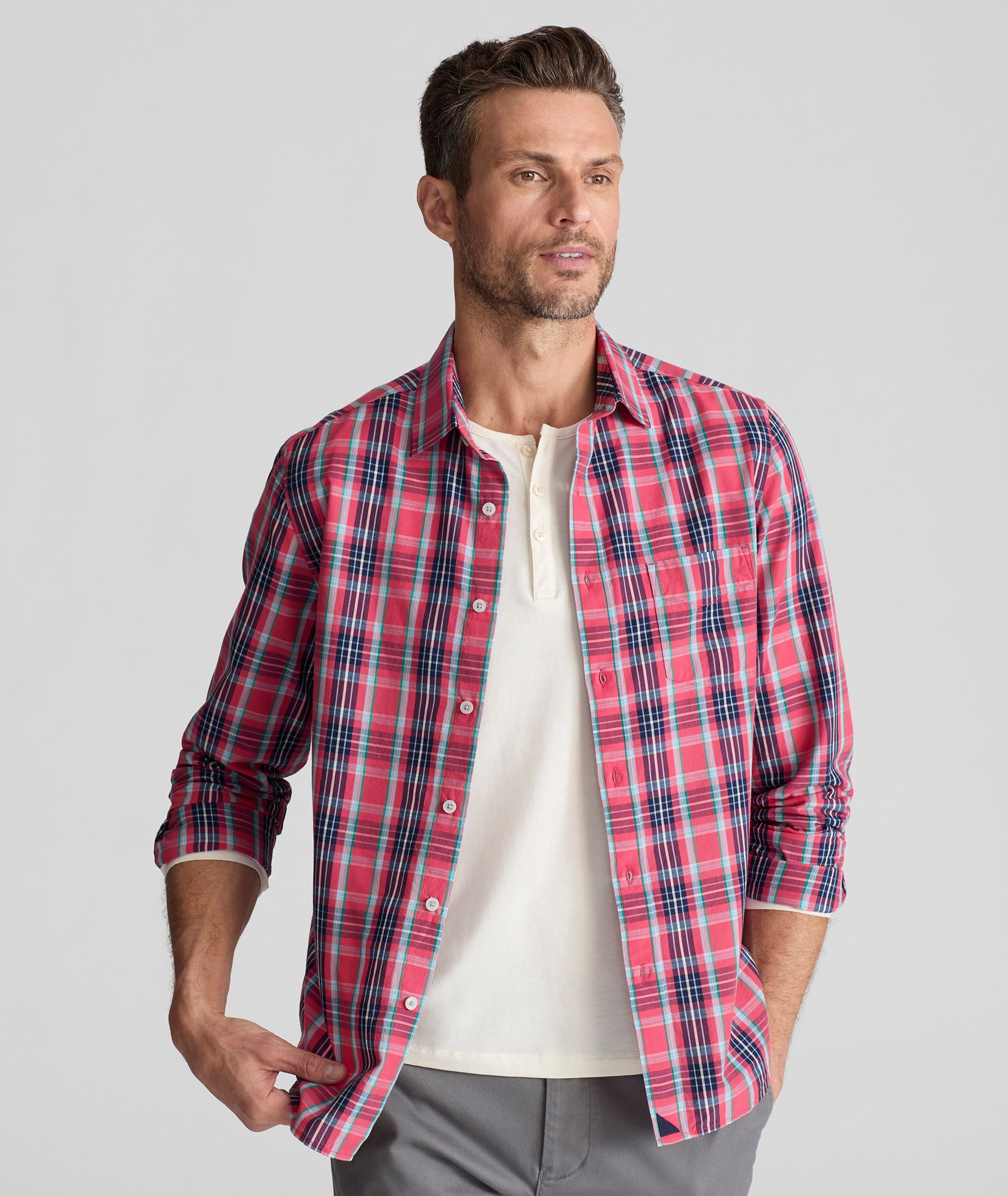 Model is wearing UNTUCKit Santa Barbara shirt in summer plaid. 