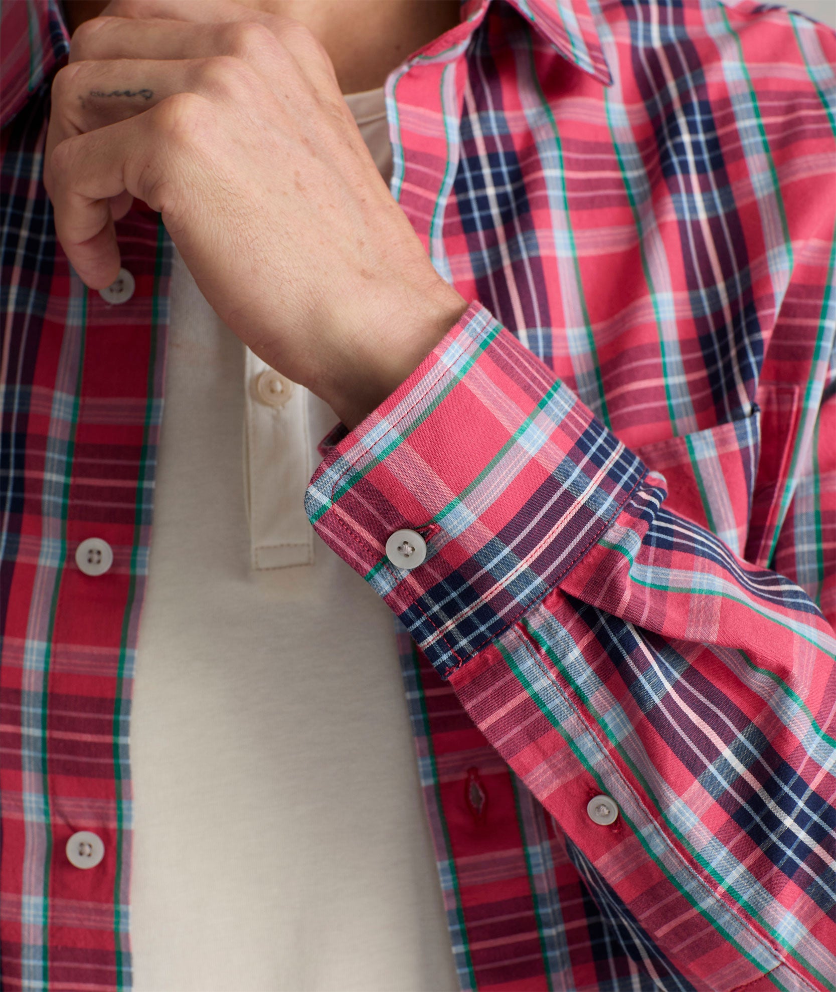 Model is wearing UNTUCKit Santa Barbara shirt in summer plaid. 