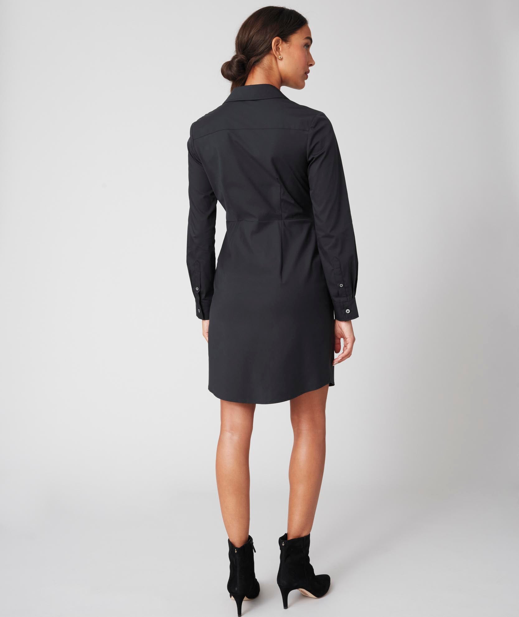 Model is wearing UNTUCKit black Sinead dress.