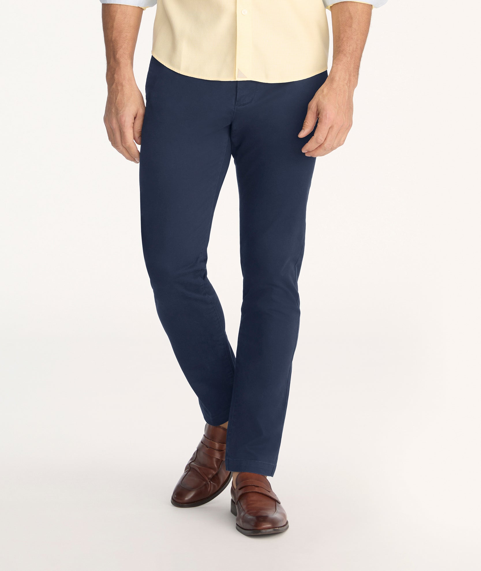 Model is wearing UNTUCKit Classic Chino Pants in Navy.