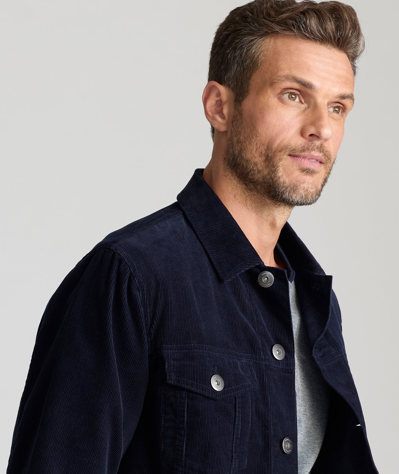 Model is wearing UNTUCKit Tibouren cord jacket in Navy.