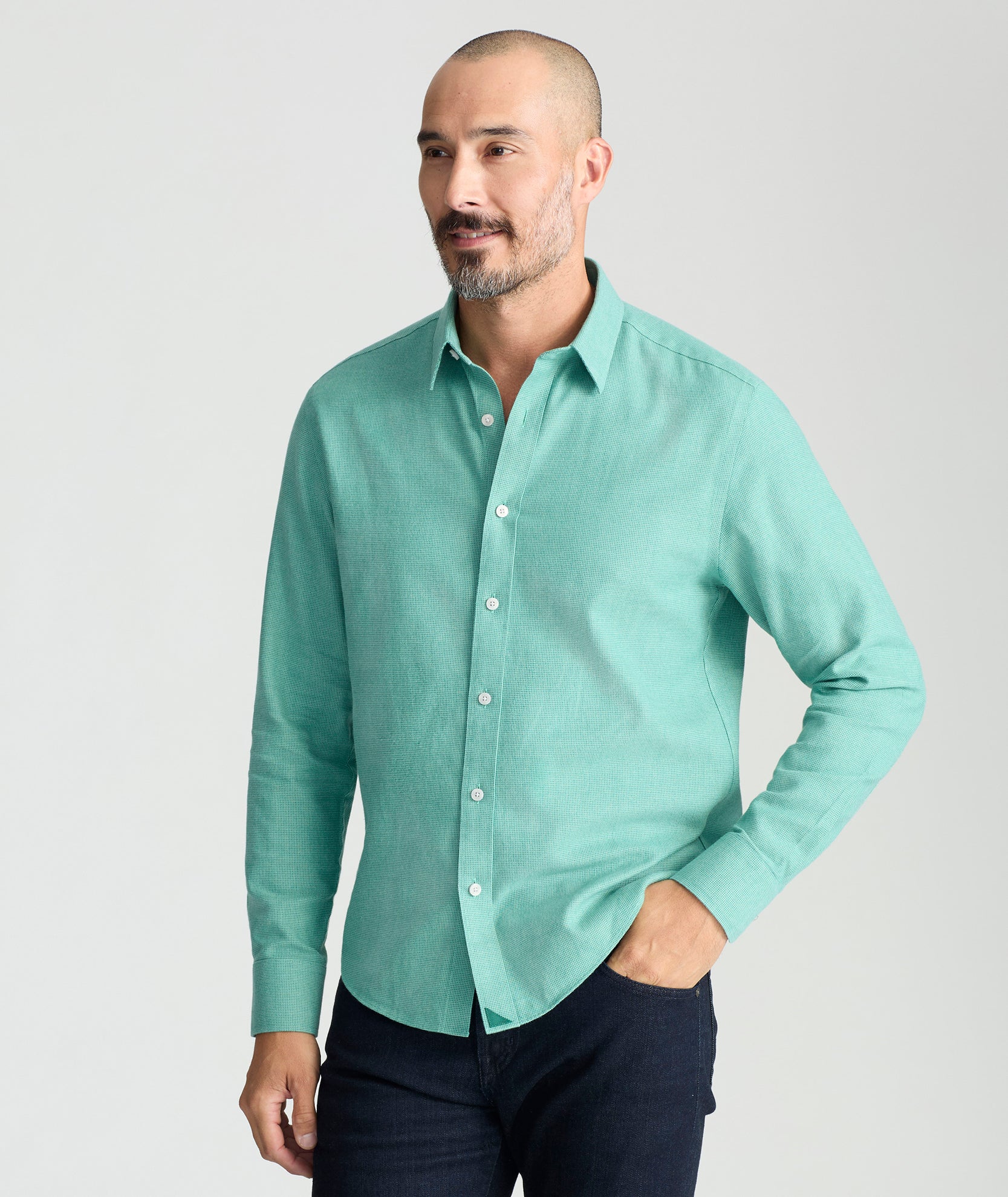 Model is wearing UNTUCKit Wrinkle-Free Veneto Shirt in bright green.