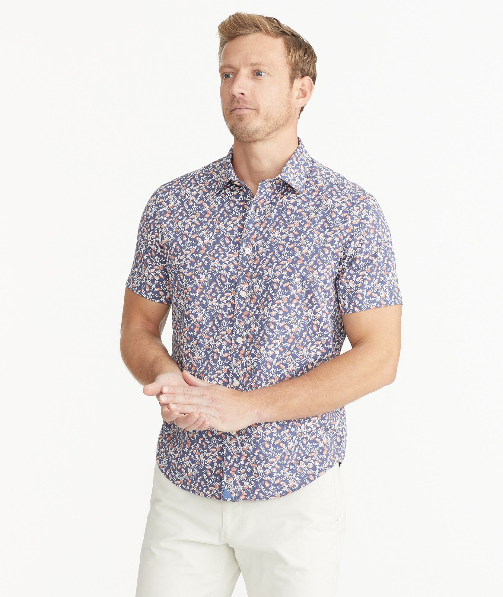 Model is wearing UNTUCKit Navy Cotton Short-Sleeve Buckley Shirt