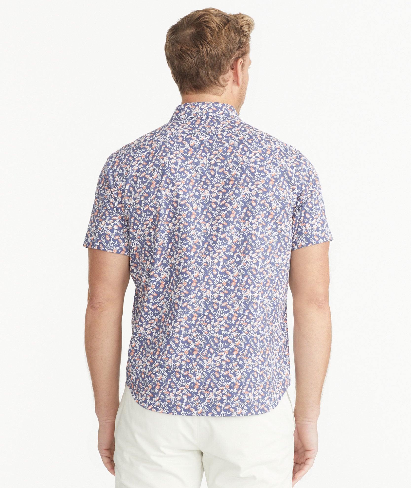 Model is wearing UNTUCKit Navy Cotton Short-Sleeve Buckley Shirt