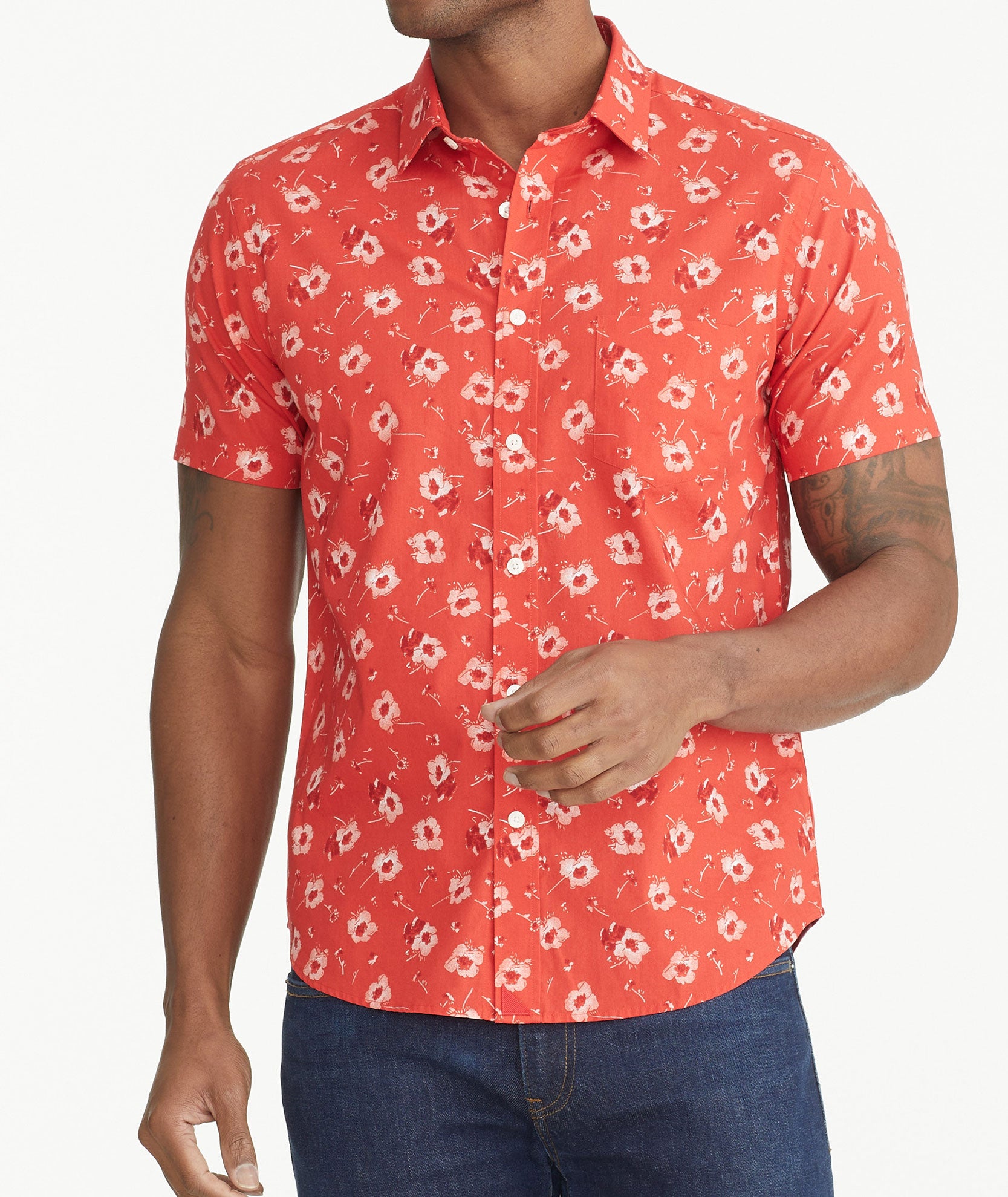 Model is wearing UNTUCKit Poppy Red Print Cotton Short-Sleeve Coolidge Shirt.