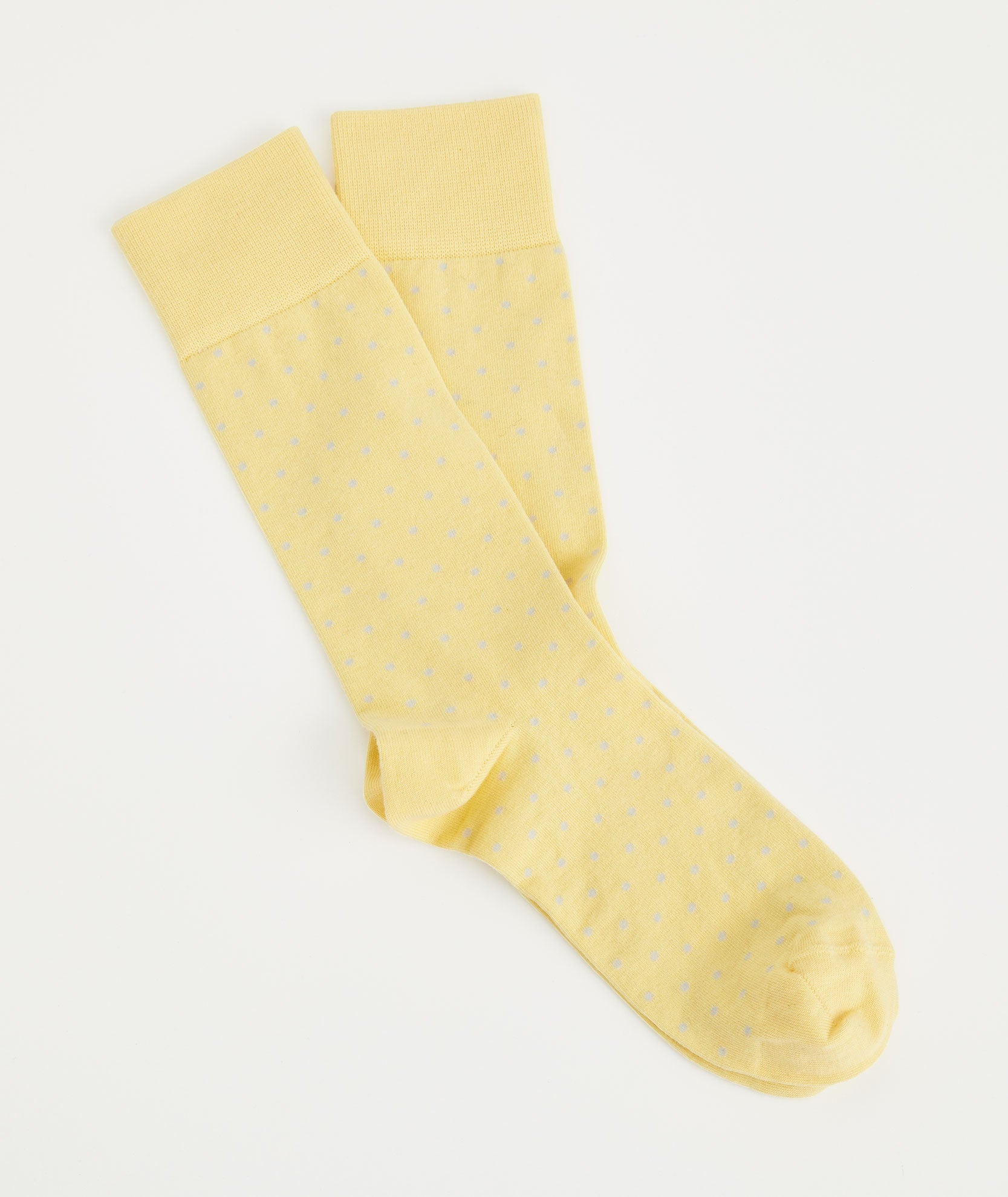 Model is wearing UNTUCKit Yellow Popcorn dot Print classic cotton socks.