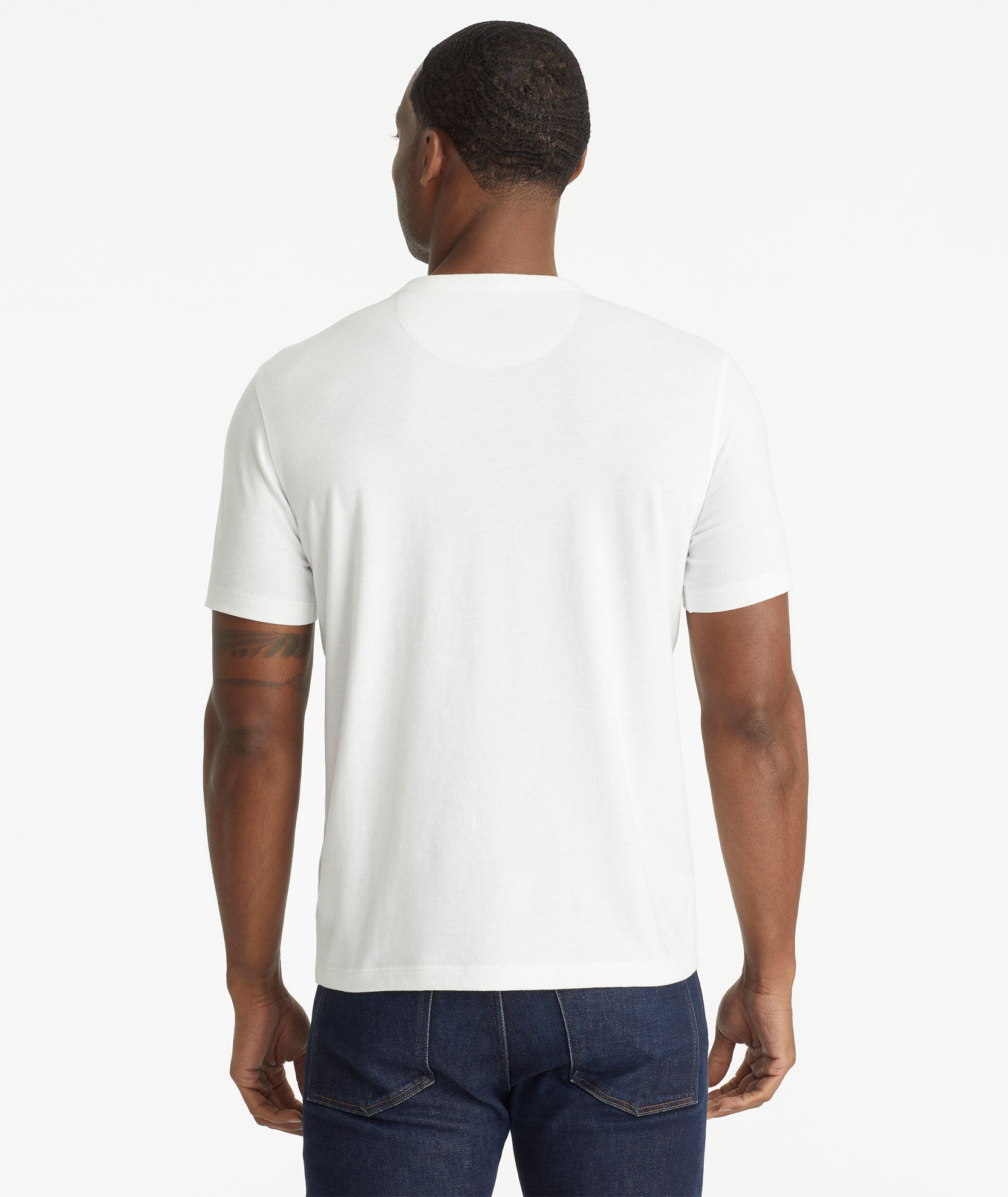 Model wearing an UNTUCKit White Ultrasoft Short-Sleeve Henley